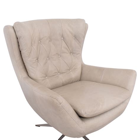 A swivel chair couldn't get more inviting than this. 70% OFF - Pottery Barn Pottery Barn Wells Leather Swivel ...