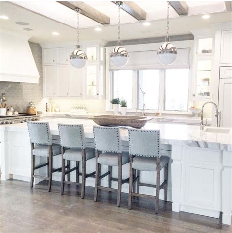As in the image above, the chairs in this kitchen help to bring the wood color of the island further into the. Everything about this | Classy kitchen, Stools for kitchen ...