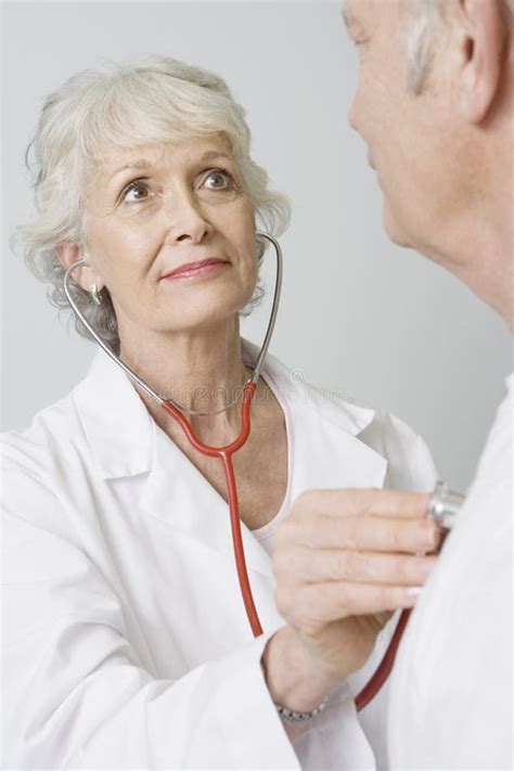 Doctor Checking Patient S Heartbeat Using Stethoscope Stock Photo