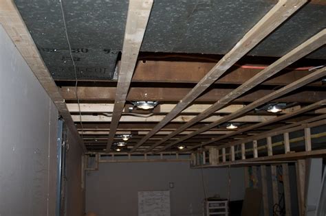 Wood furring strip ceilings | doityourself.com. Basement ceiling with all furring strips in place ...