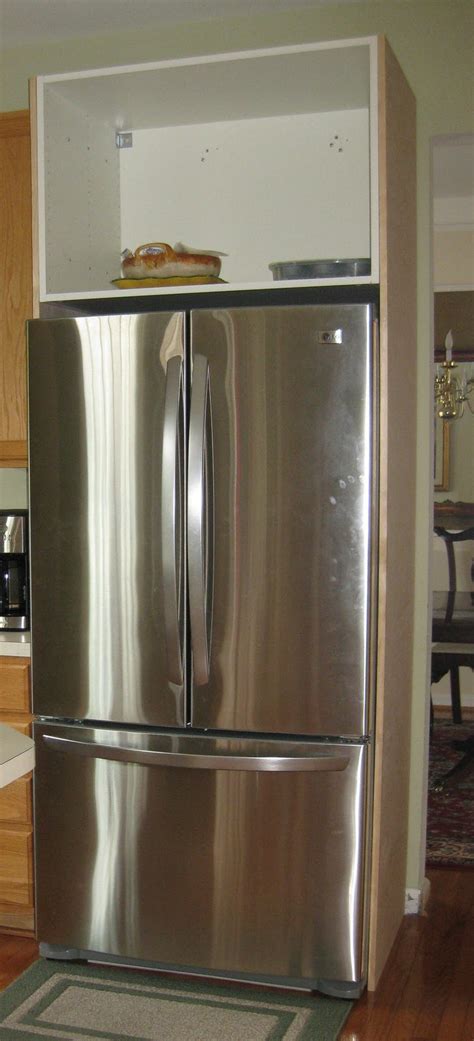 A diy refrigerator cabinet makes a kitchen look more custom. Building the Refrigerator Enclosure - Remodelando la Casa