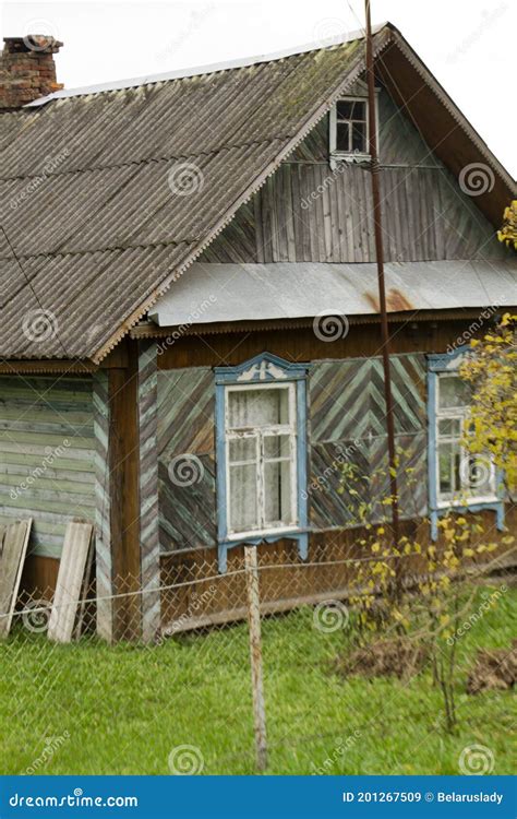 Old Traditional Wooden House With Slate Roof In Village Belarus Stock