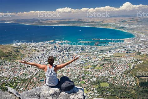 Tourist Hiker On Table Mountain Overlooking Cape Town