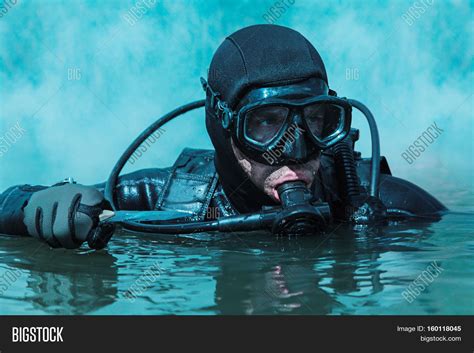 Navy SEAL Frogman With Complete Diving Gear And Weapons In The Water Stock Photo Stock Images