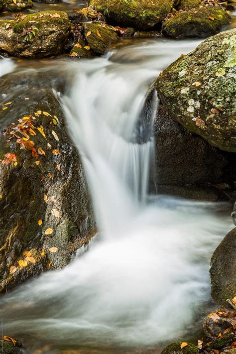 Small Waterfall Flowing Over Rocks In Autumn By Adam Nixon Landscape