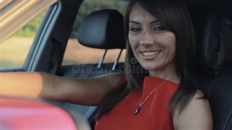 Portrait Of Beautiful Young Woman Sitting In Her Car Stock Footage