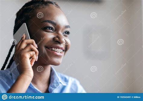 Phone Call Portrait Of Cheerful Black Woman Talking On Cellphone