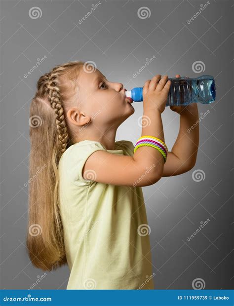Adorable Little Girl Drinking Fresh Clean Water From Plastic Bottle On