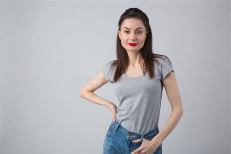 Cute Young Adult Woman In 30s Wearing Casual Clothes In Studio Stock