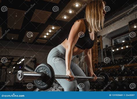 Young Woman Lifting Barbell With Light Weights At Gym Fitness Female Doing Crossfit Workout