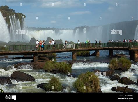 Tourists On Viewing Platform On Brazil Side Of Iguazu Falls Brazil