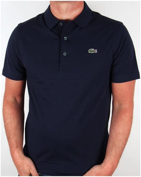 Polo shirt.short sleeves.slim fit.collar with placket & buttons.solid pique.ottoman stitch detailing at collar & cuffs.contrast colour tipping details at collar & cuffs.tonal lion embroidery at chest. Lacoste Polo Shirt Navy, short, sleeve, old skool, retro