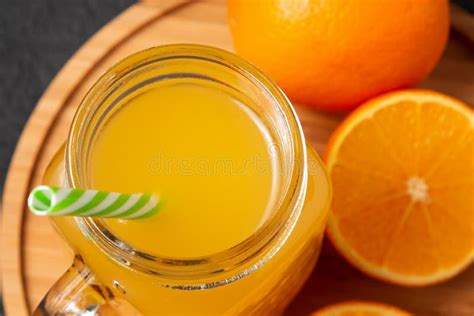 Homemade Freshly Squeezed Orange Juice In A Mason Jar And Oranges On