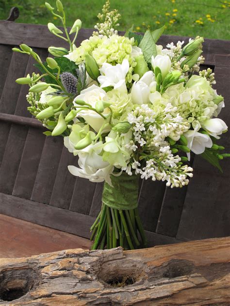 A typical wedding party will require a bridal bouquet, smaller bouquets for all of the bridesmaids, buttonholes for the groom/groomsmen plus floral arrangements for decoration. bouquet of white dendrobium orchids, lilacs, roses ...