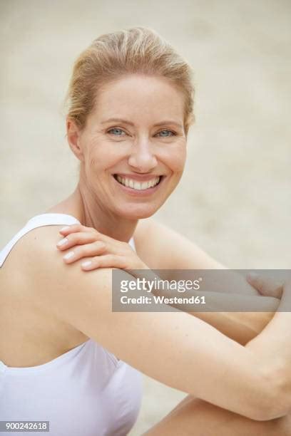 middle aged woman blonde beach photos and premium high res pictures getty images