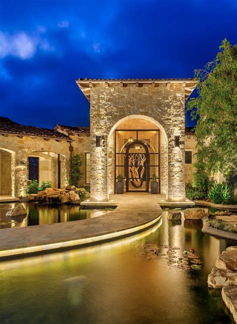 Mediterranean Design Entry With Pool And Stone Facade Mansions