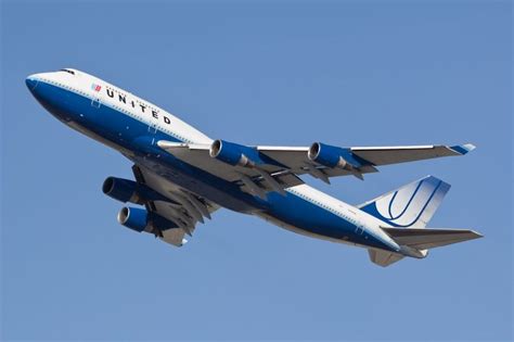 An United Airlines Boeing 747 400 In The Old Blue Tulip Livery Climbing