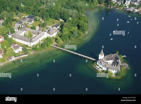 Medieval Castle On A Lake With A Footbridge For Access Aerial View
