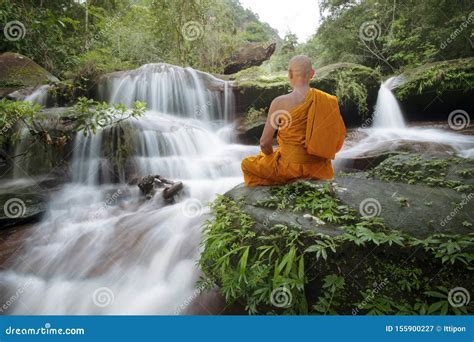 Buddha Monk Practice Meditation At Waterfall Editorial Photography