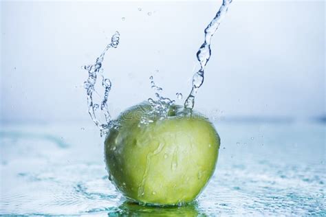 Green Apple With Freezed Water Splash Stock Photo Image Of Ripe