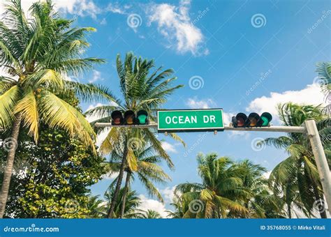 Ocean Drive In Miami Road Sign And Green Traffic Light Stock Image