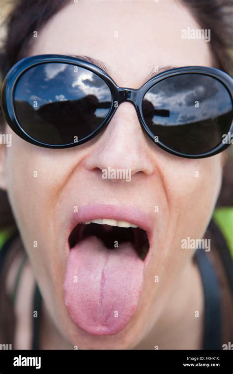 Close Up Of Face Brunette Woman With Black Sunglasses Looking And