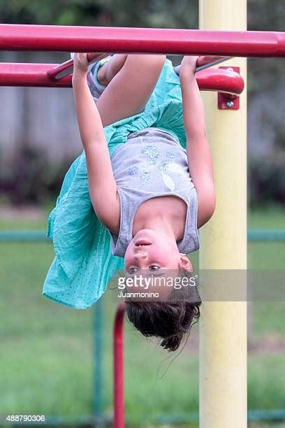 Girl Hanging Upside Down In A Playground Photos And Premium High Res Pictures Getty Images