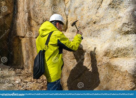 Geologist Takes A Rock Sample Stock Photo Image Of Outcrop Examines