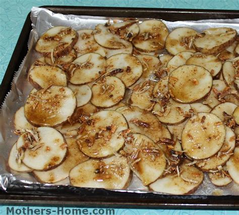 Thinly sliced potatoes are placed in a slow cooker in a spiral pattern. lipton onion soup mix potatoes