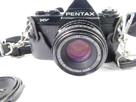 A Pentax Mv Camera With A Smc Pentax M 12 50mm Lens 5157291 A Tokina