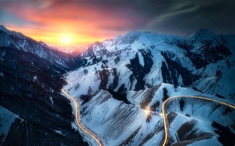 1920x1200 Aerial View Snow Mountains Sunset Clouds Sky Road