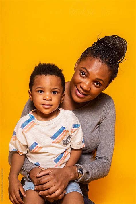 Black Mother And Son Looking At Camera Del Colaborador De Stocksy
