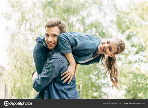 Guy Carrying Girlfriend Over Shoulder