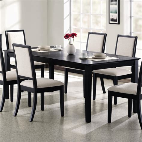 If you want an ageless aesthetic, consider a wood dining table in a black finish. Coaster Lexton 101561 Rectangular Dining Table with 18 ...