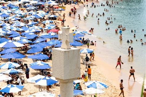 high view of tourist people having fun at porto da barra beach editorial image image of wave