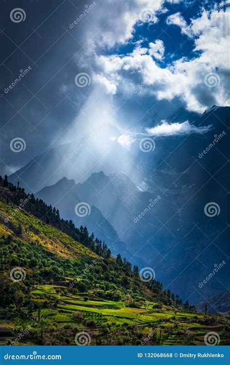 Sun Rays Through Clouds In Himalayan Valley In Himalayas Stock Photo