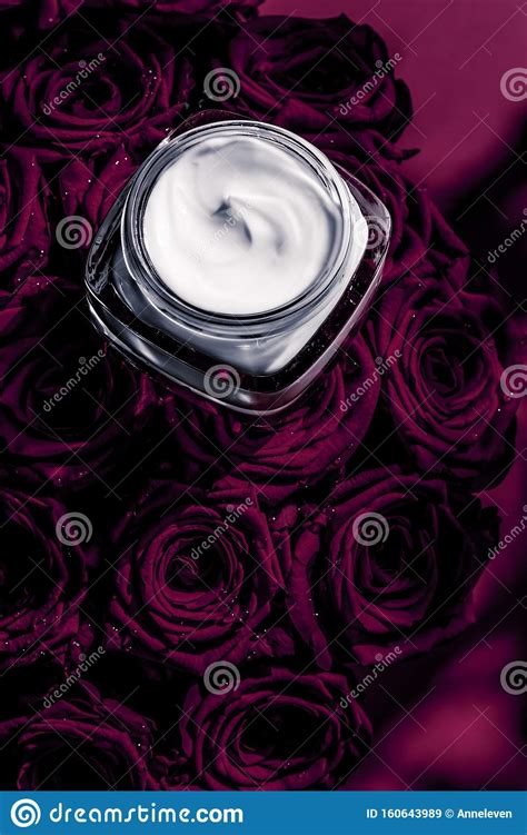 Face Cream Skin Moisturizer And Dark Purple Flowers Luxury Skincare