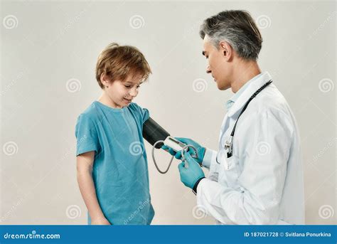 Kids In Hospital Professional Mature Doctor Pediatrician In Medical
