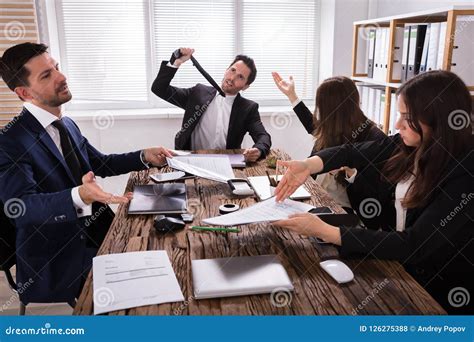 Group Of Frustrated Businesspeople In Meeting Stock Photo Image Of