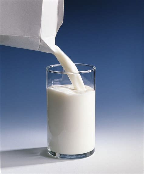 Pouring Milk From Tetrapak Carton Into License Images 364605
