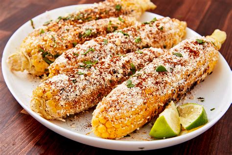 Corn on the cob is grilled to charred perfection before it's topped with smoky seasonings, zesty lime juice, and crumbled cotija cheese for this mexican street dish. Chilis Street Corn Recipe | Sante Blog