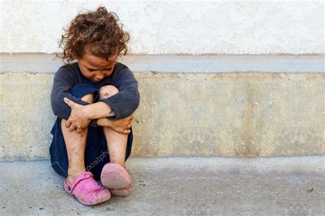 Poor Sad Little Child Girl Sitting Against The Concrete Wall — Stock