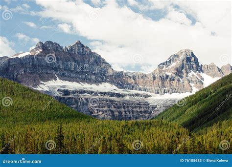 Rocky Mountain Peaks Towering Over Evergreen Forest Stock Image Image