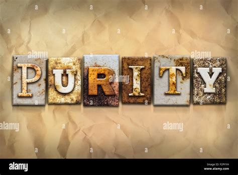 The Word Purity Written In Rusty Metal Letterpress Type On A Crumbled