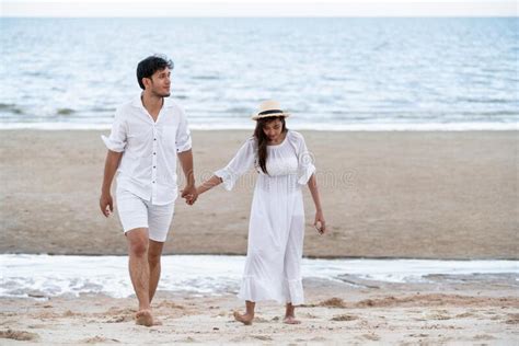 Happy Young Couple Walk On The Beach On Honeymoon Stock Image Image