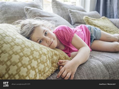Portrait Of Girl Lying On Couch Stock Photo Offset