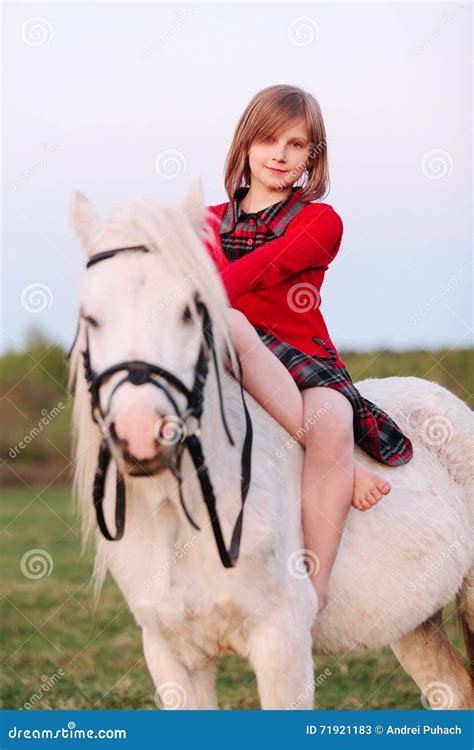 Portrait Of A Baby Girl Sitting On A White Pony Stock Image Image Of