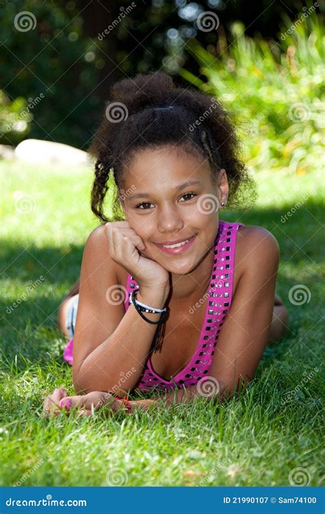 Young Black Teenage Girl Lying On The Grass Stock Image Free Download