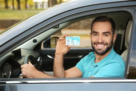 Young Man Holding Driving License Stock Photo Image Of Safety