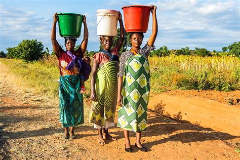 Women Carrying Water Where It All Started For Hippo Roller • Hippo Roller